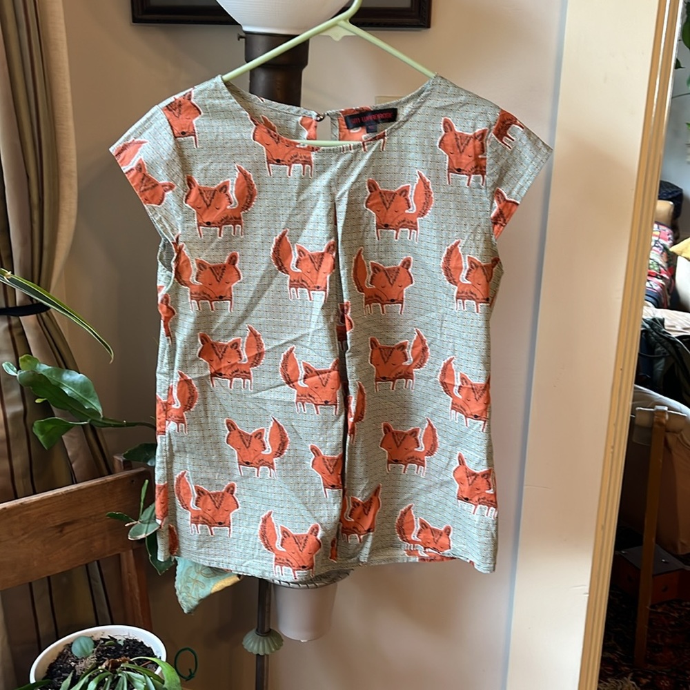Adorable fox print shirt very soft and thin cap sleeves, flattering.